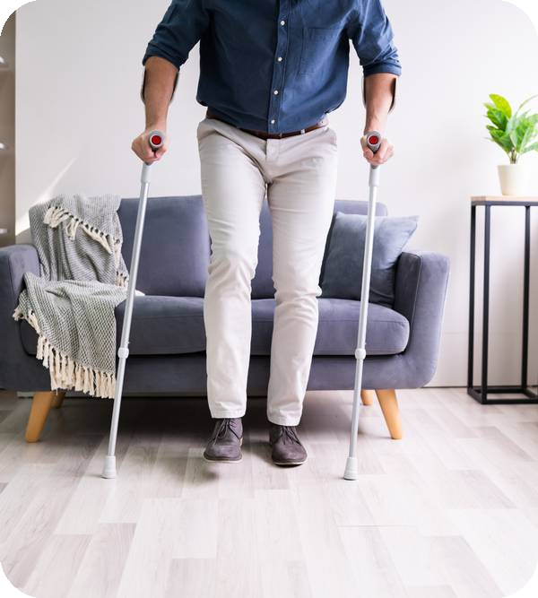 Man holding Crutches